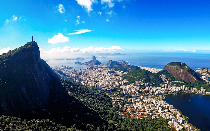 Christ the Redeemer overlooking Rio de Janeiro with Sugarloaf Mountain in the background.