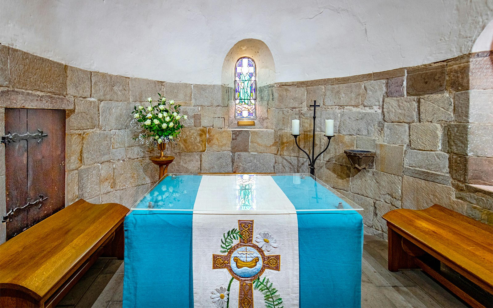 St. Margaret's Chapel altar with stained glass window at Edinburgh Castle.