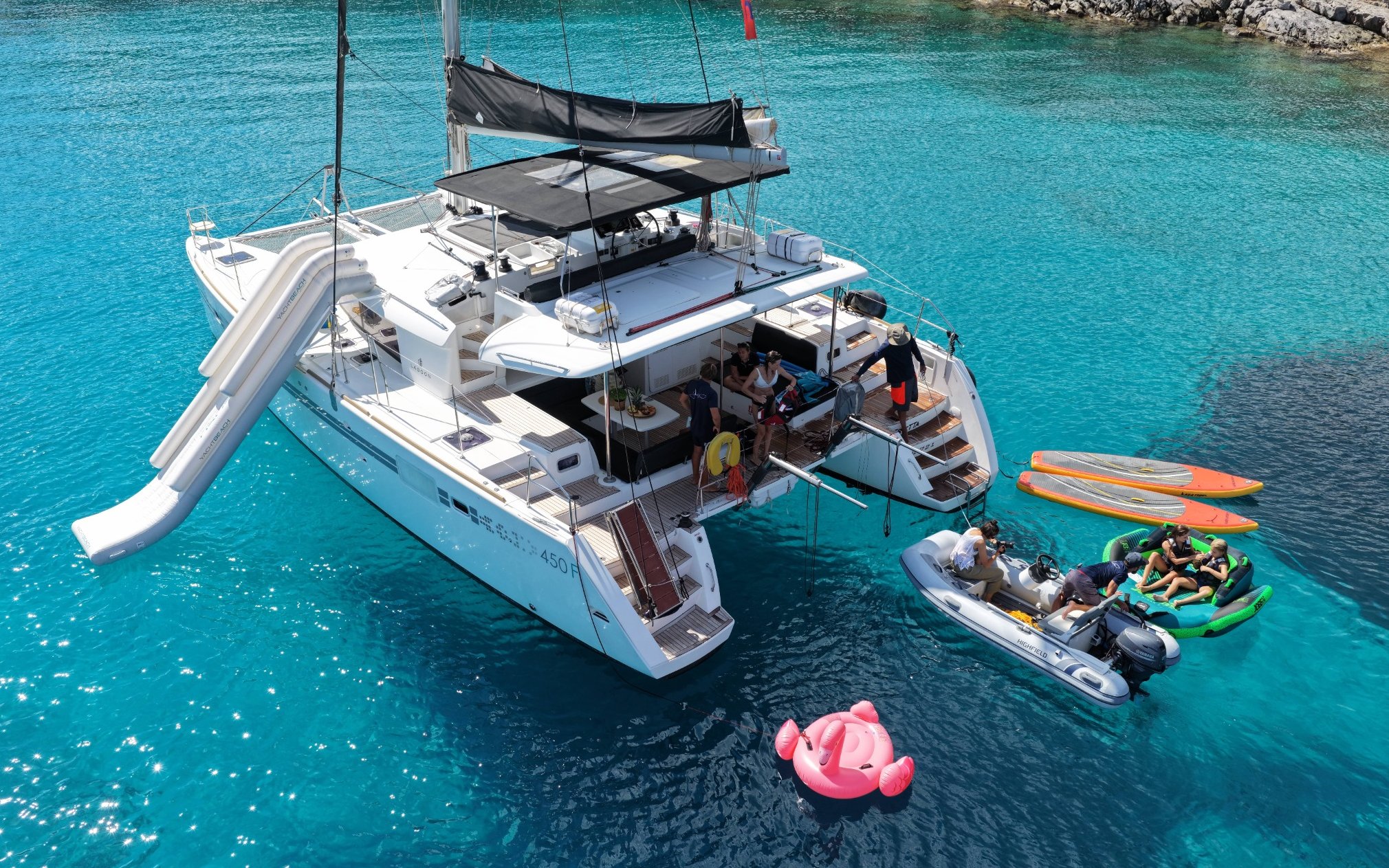 Catamaran with slide and paddleboards near Spinalonga, Crete.