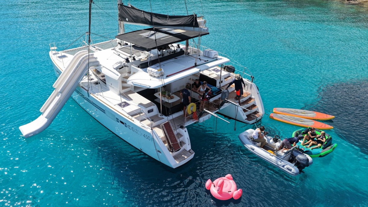 Catamaran with slide and paddleboards near Spinalonga, Crete.