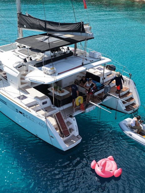 Catamaran with slide and paddleboards near Spinalonga, Crete.