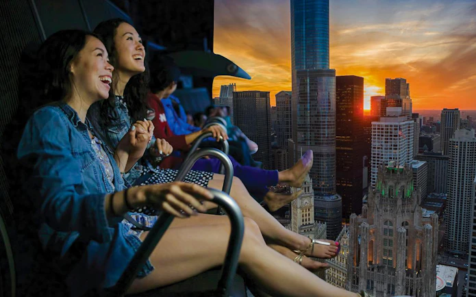 Guests enjoying Flyover Las Vegas experience with city skyline view.
