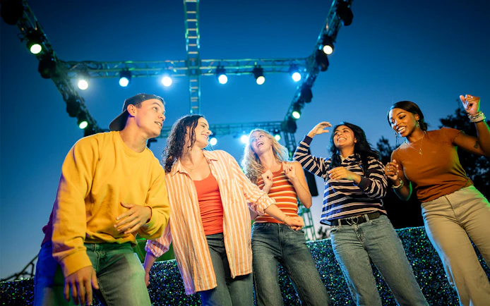 Group of friends enjoying the Snicker's Halloween Event at Six Flags SCarowinds Zone.