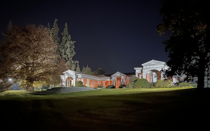 Concha y Toro vineyard's summer house exterior illuminated at night during dinner show.
