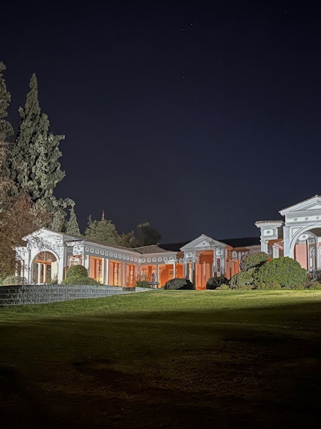 Concha y Toro vineyard's summer house exterior illuminated at night during dinner show.