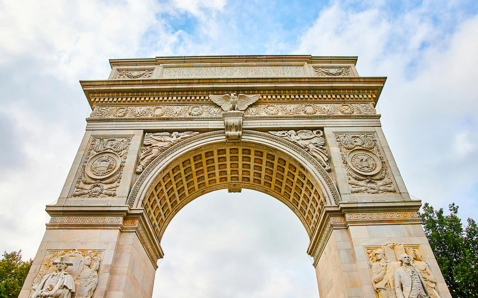 Washington Square Park arch top view with sky background.