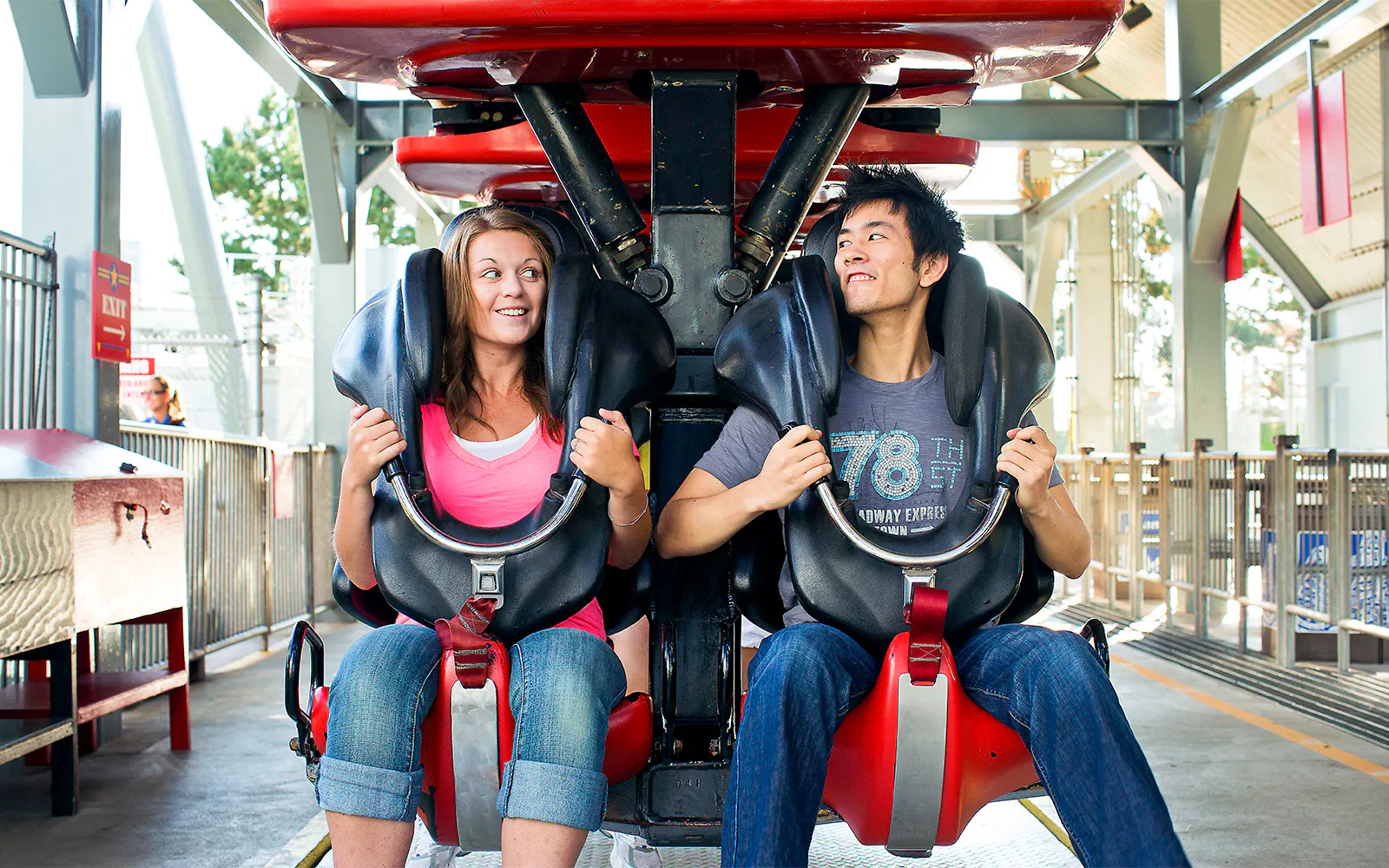 Riders seated on the Mind Eraser roller coaster at Six Flags Darien Lake.