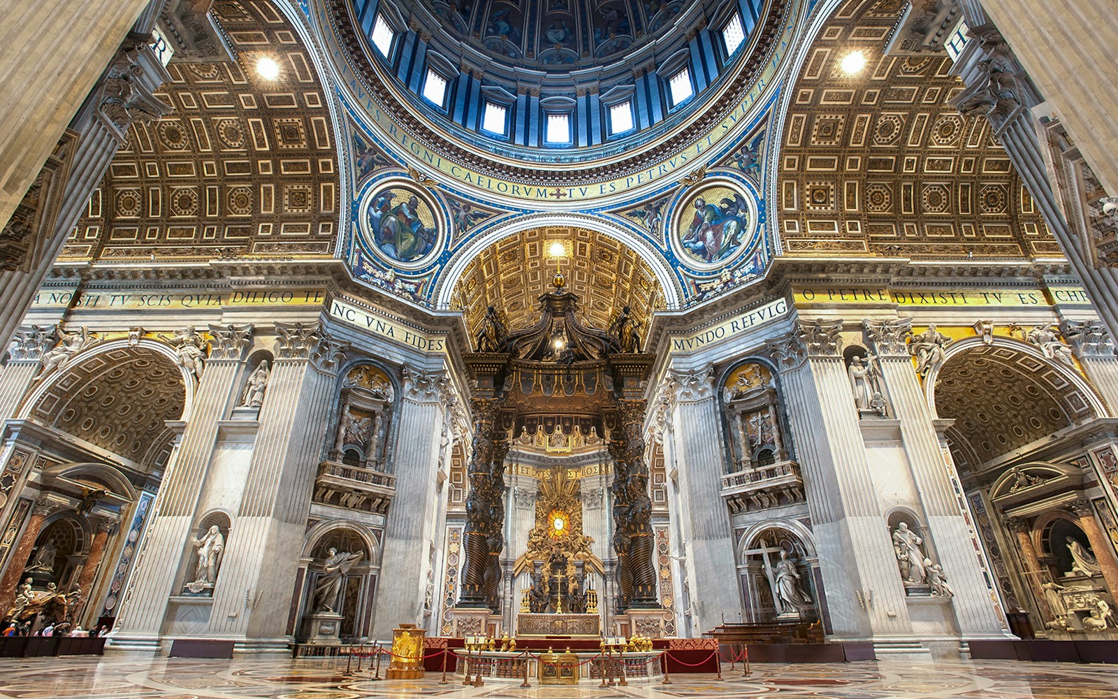 St. Peter's Basilica interior with Bernini's Baldacchino under the dome in Vatican City.