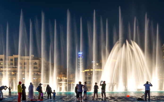 People watching the Dubai fountain show at night.