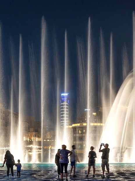 People watching the Dubai fountain show at night.