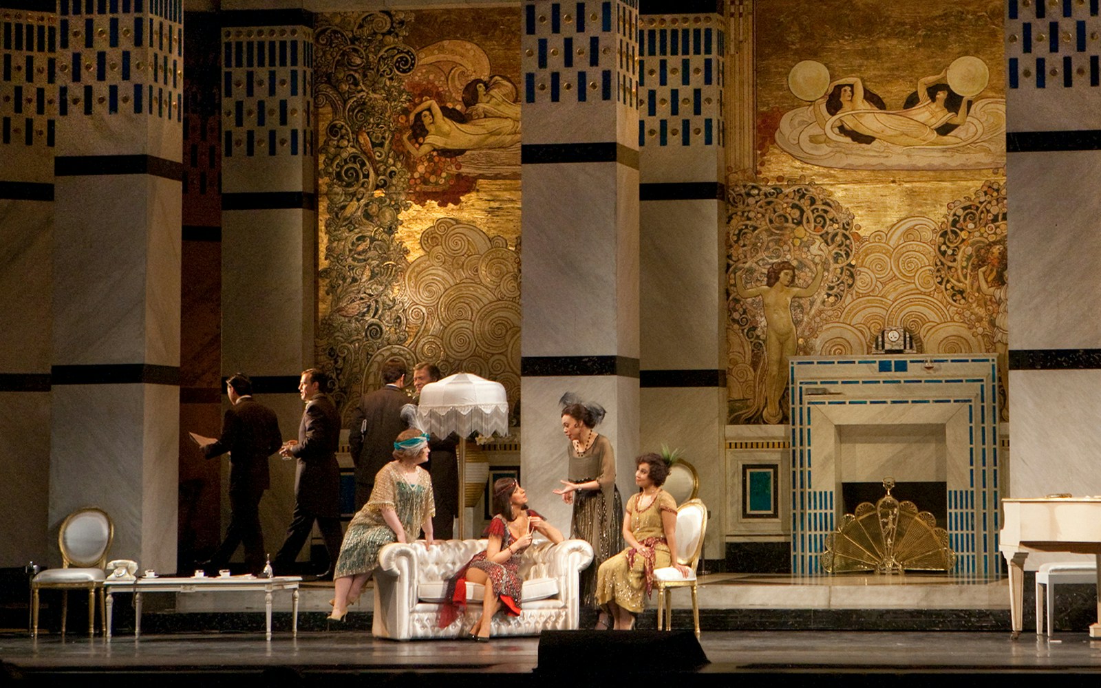Opera performance of La Rondine with actors in period costumes on an ornate stage.