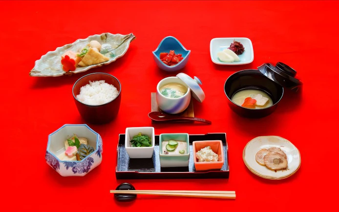 Traditional Japanese lunch box with assorted dishes for Maiko dining experience.