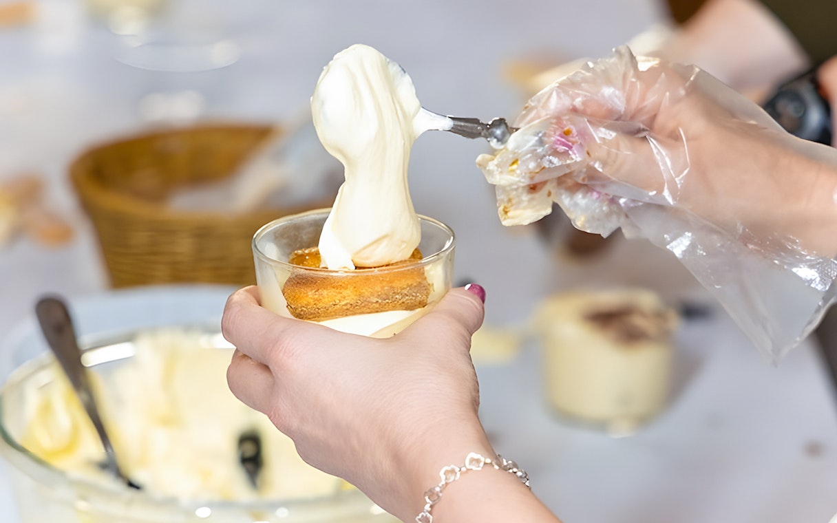 Tiramisù preparation during a cooking class in Rome near Piazza Navona.