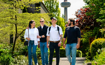 Group walking near Skylon Tower on Niagara Falls tour.