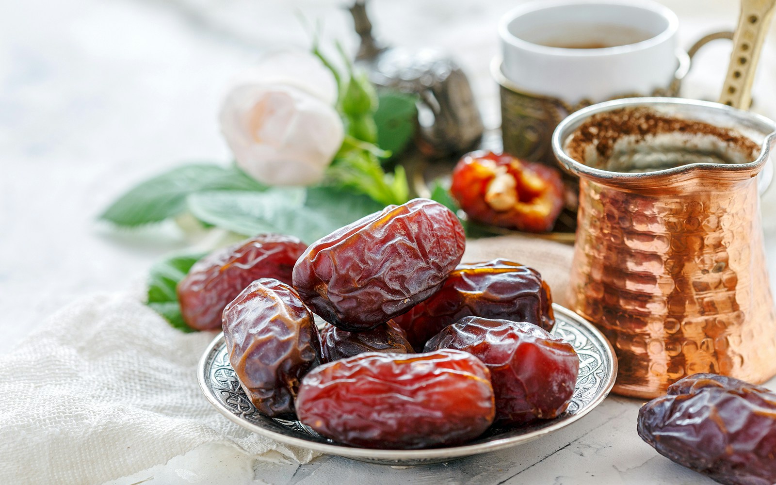 Plate of dried dates on a table during Dubai Marina dhow cruise dinner.