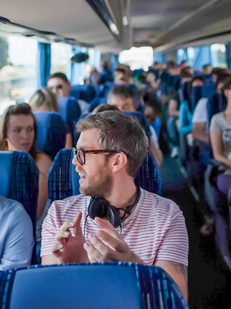 Passengers seated inside a Terravision bus heading to the airport.