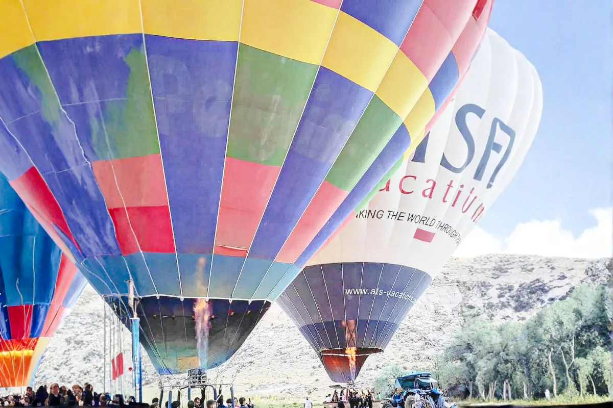 Hot air balloons preparing for flight at sunrise in Ihlara Canyon, Cappadocia.