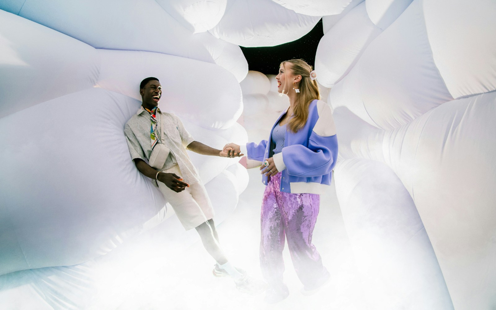 Couple enjoying immersive art installation at WONDR Experience.