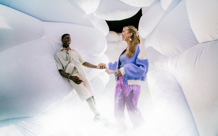 Couple enjoying immersive art installation at WONDR Experience.