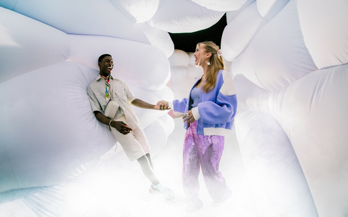 Couple enjoying immersive art installation at WONDR Experience.