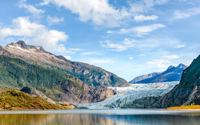Mendenhall Glacier with surrounding mountains and lake in Juneau, Alaska.
