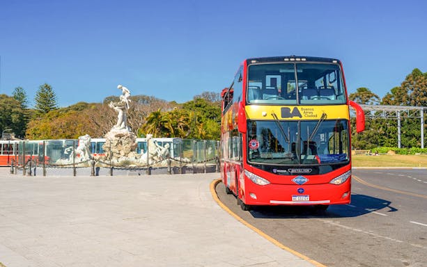 Buenos Aires city bus near Monumental Fountain of the Nereids.