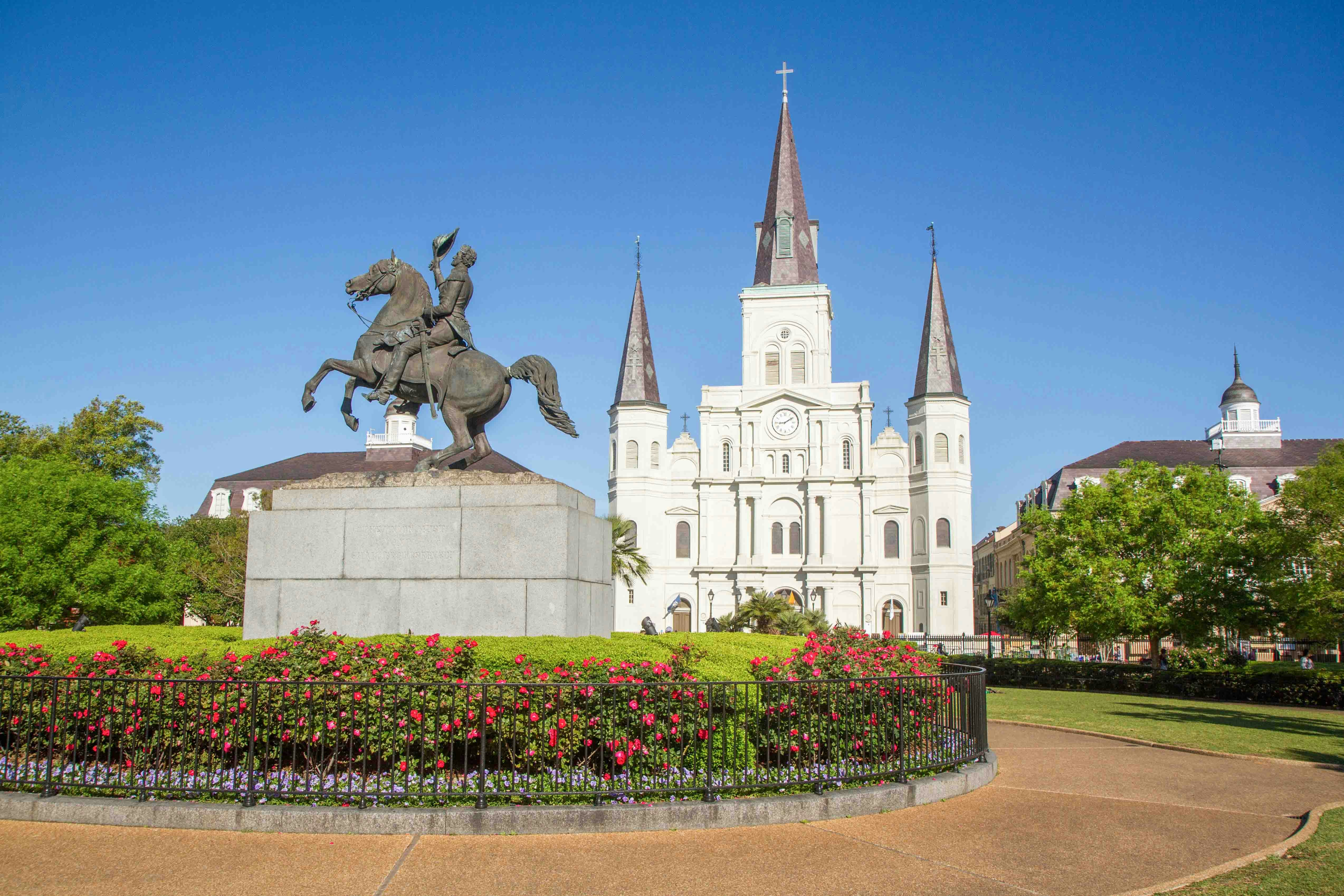 Tourists exploring Jackson Square, a historic park in the heart of the French Quarter, New Orleans