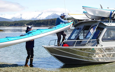 Loading kayaks onto a boat for a whale-watching tour in Juneau.