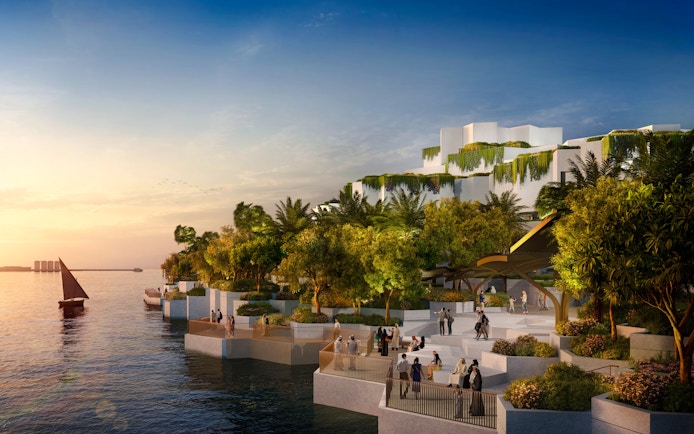 National History Museum Abu Dhabi exterior at sunset with waterfront and visitors.