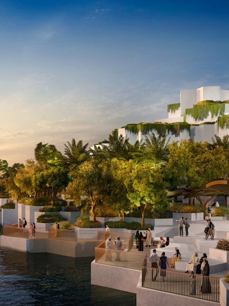 National History Museum Abu Dhabi exterior at sunset with waterfront and visitors.