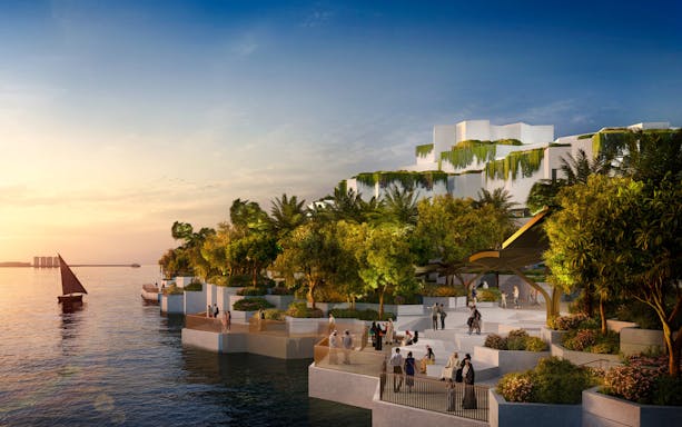 National History Museum Abu Dhabi exterior at sunset with waterfront and visitors.