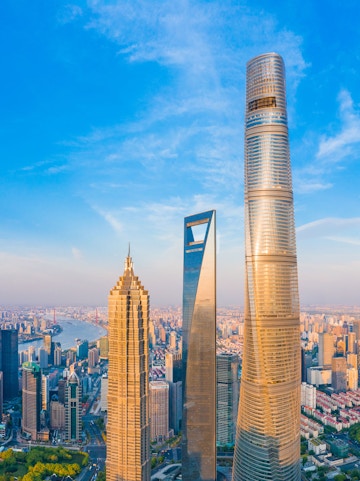 Shanghai skyline with Jin Mao Tower, Shanghai World Financial Center, and Shanghai Tower.