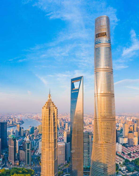 Shanghai skyline with Jin Mao Tower, Shanghai World Financial Center, and Shanghai Tower.