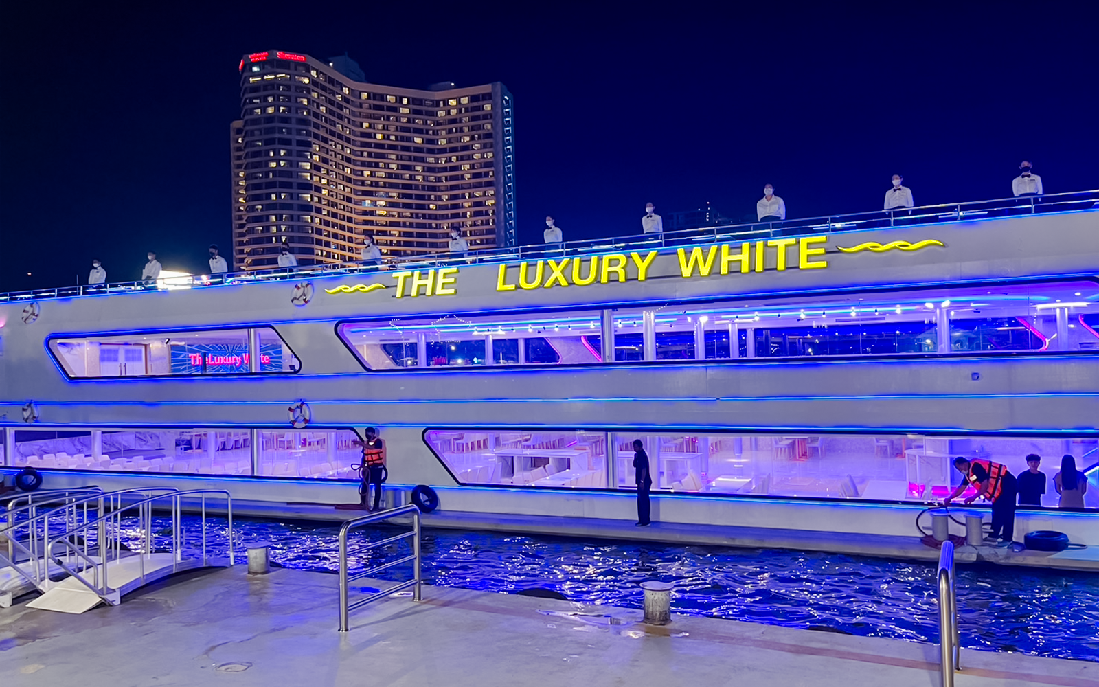 Luxury dinner cruise on Chao Phraya River, Bangkok, with views of ICONSIAM and city skyline.