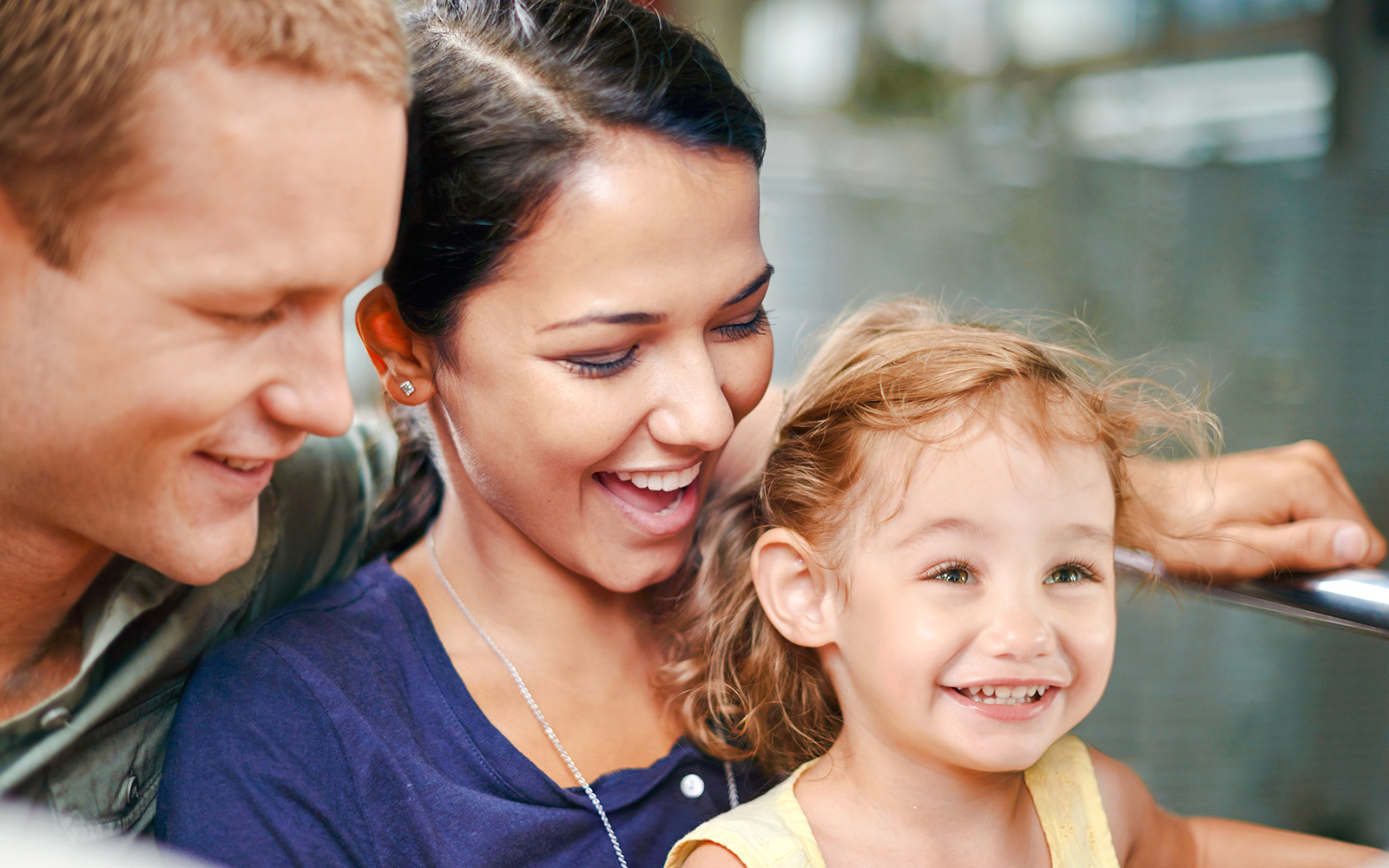 Family enjoying a ride at an amusement park.