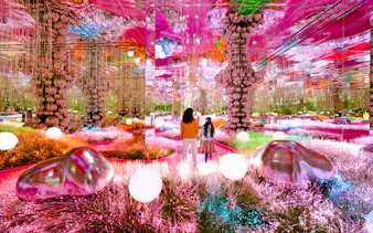 Visitors exploring a vibrant mirrored room at House of Hype, Dubai.