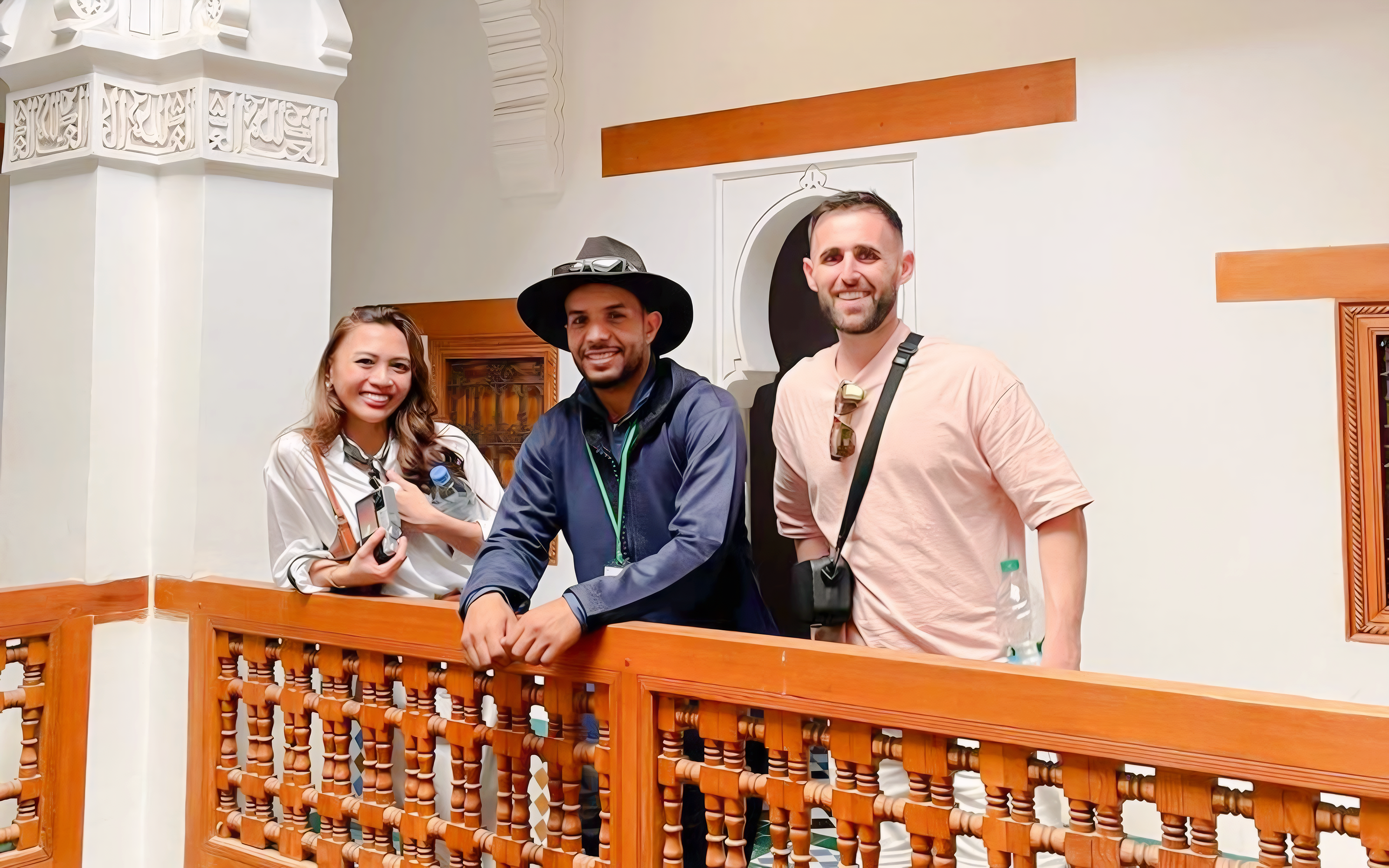 Tourists with guide at Ben Youssef Madrasa, Marrakech, Morocco.