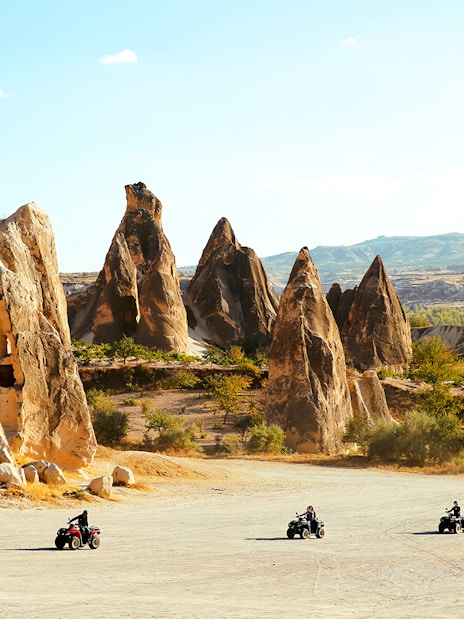 ATV riders exploring the unique rock formations in Cappadocia.