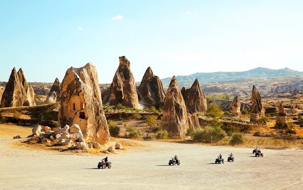 ATV riders exploring the unique rock formations in Cappadocia.