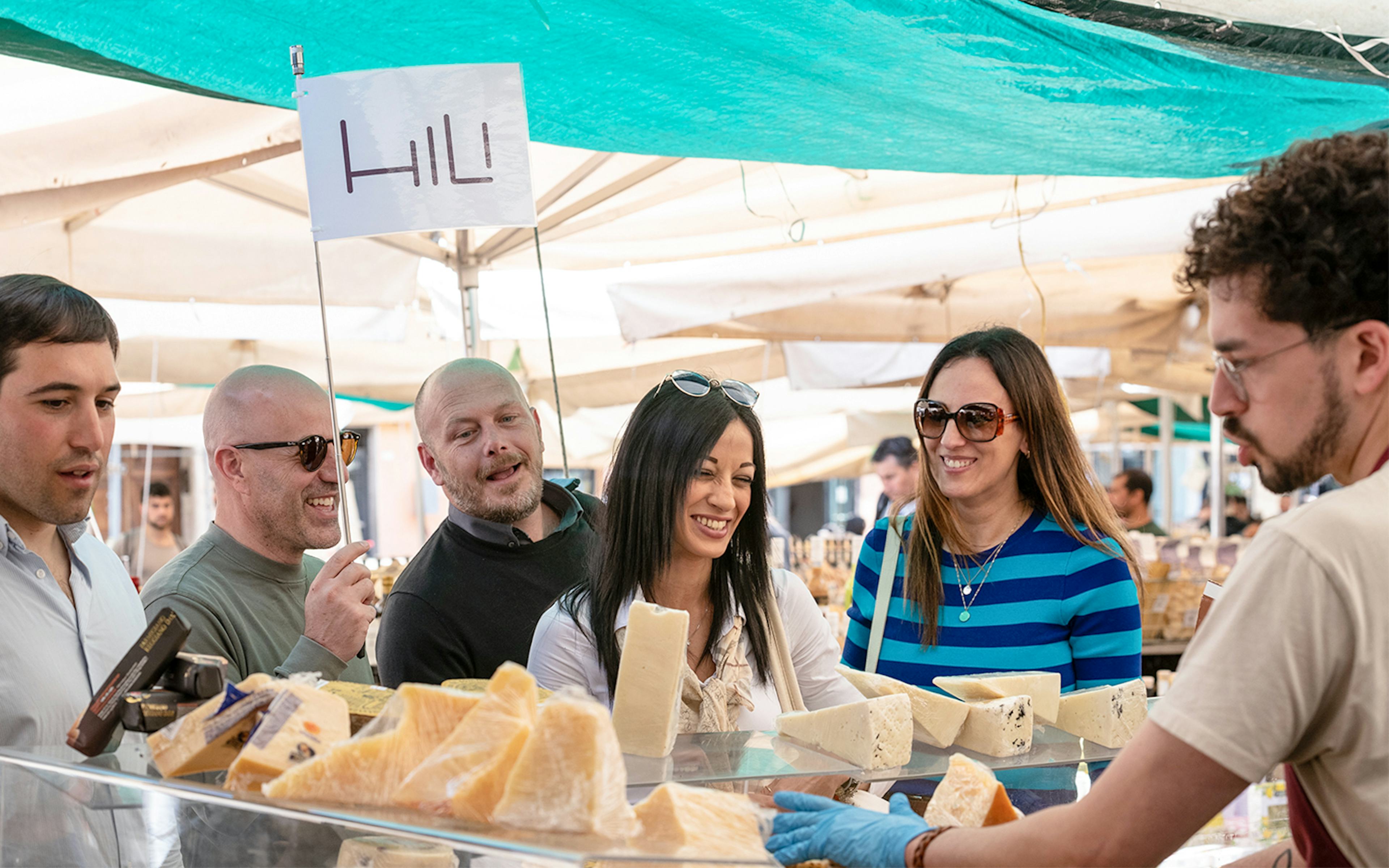 Participants try cheese on a Palermo Street Food Tour