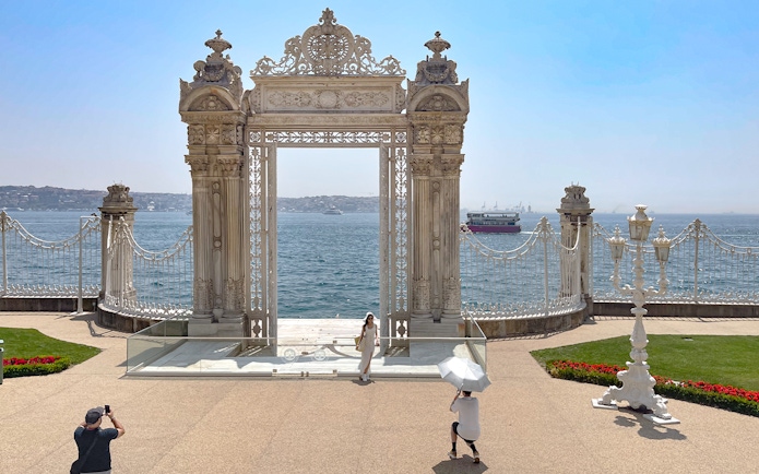 Imperial gate of Dolmabahce Palace overlooking the Bosphorus, Istanbul, Turkey.