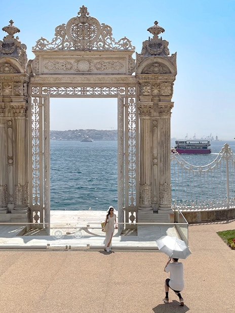 Imperial gate of Dolmabahce Palace overlooking the Bosphorus, Istanbul, Turkey.