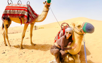 abu dhabi evening desert safari with 4x4 dune bashing, camel ride, bbq dinner and live shows-3
