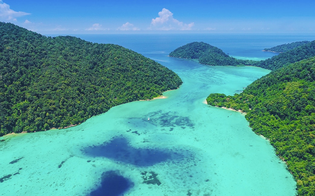Aerial view of Chong Khad Bay with lush green islands and turquoise waters.