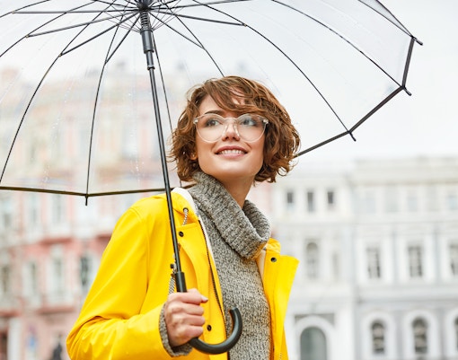 Girl with umbrella walking in milan