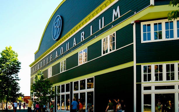 Seattle Aquarium entrance with visitors, included in Seattle CityPASS®.