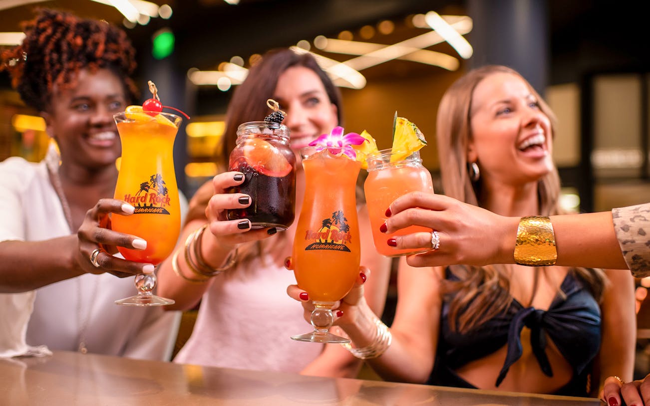 Guests toasting with cocktails at Hard Rock Cafe München.