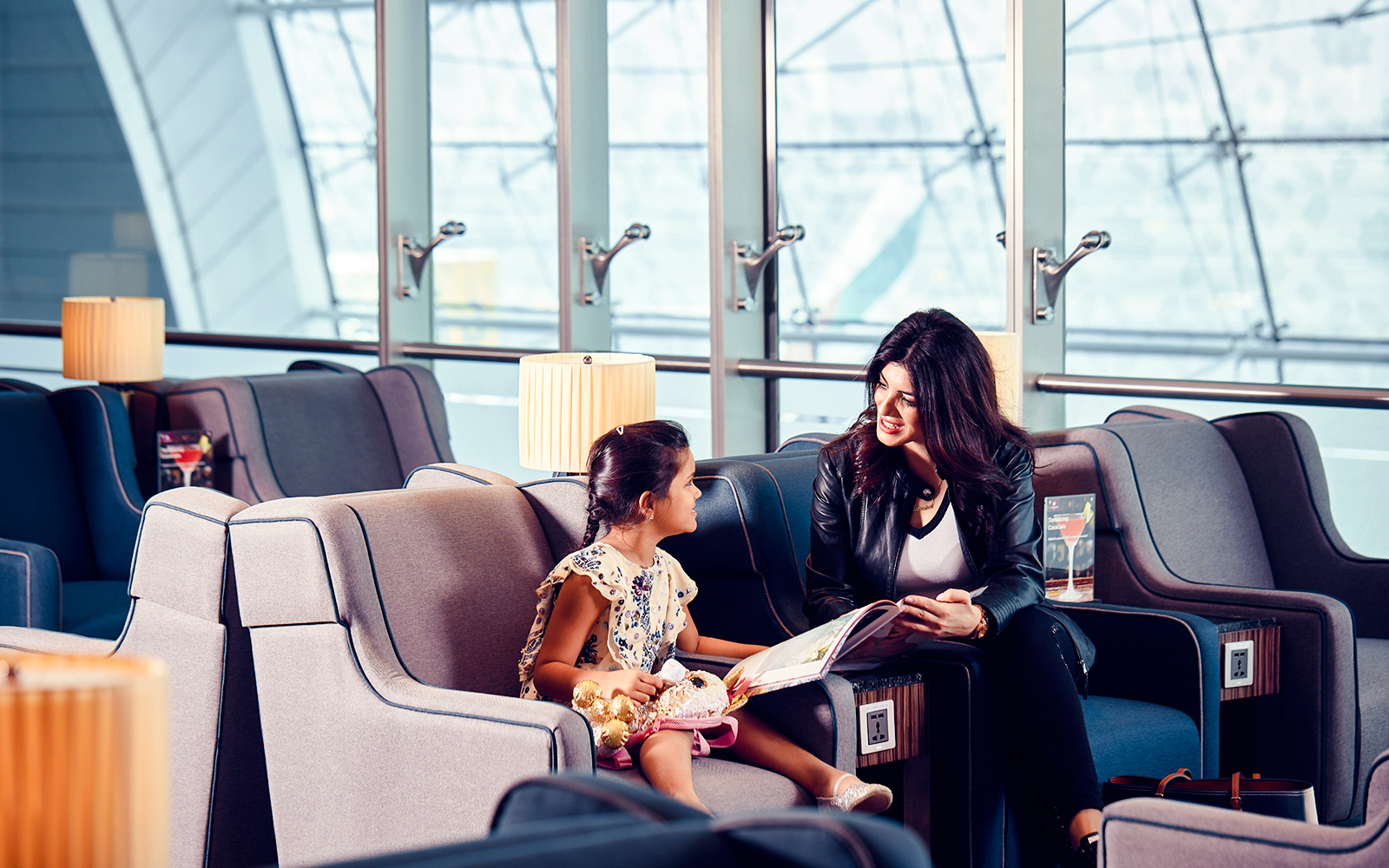 Guests relaxing in Plaza Premium Lounge at Dubai International Airport.