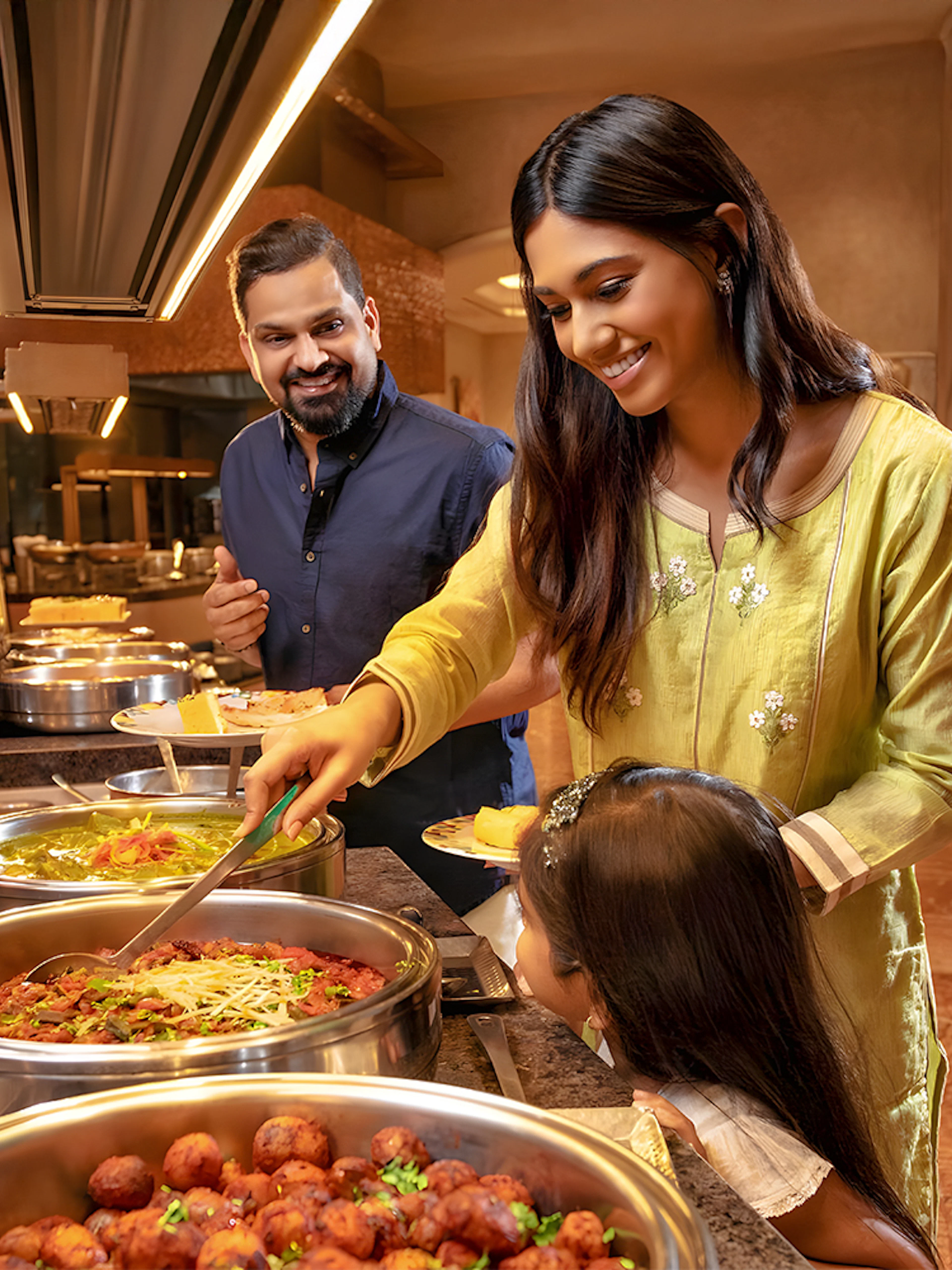 Family enjoying buffet at Kaleidoscope Atlantis Dubai.
