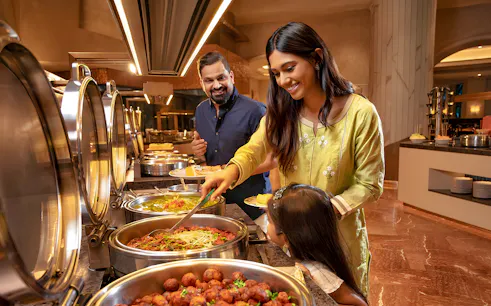 Family enjoying buffet at Kaleidoscope Atlantis Dubai.